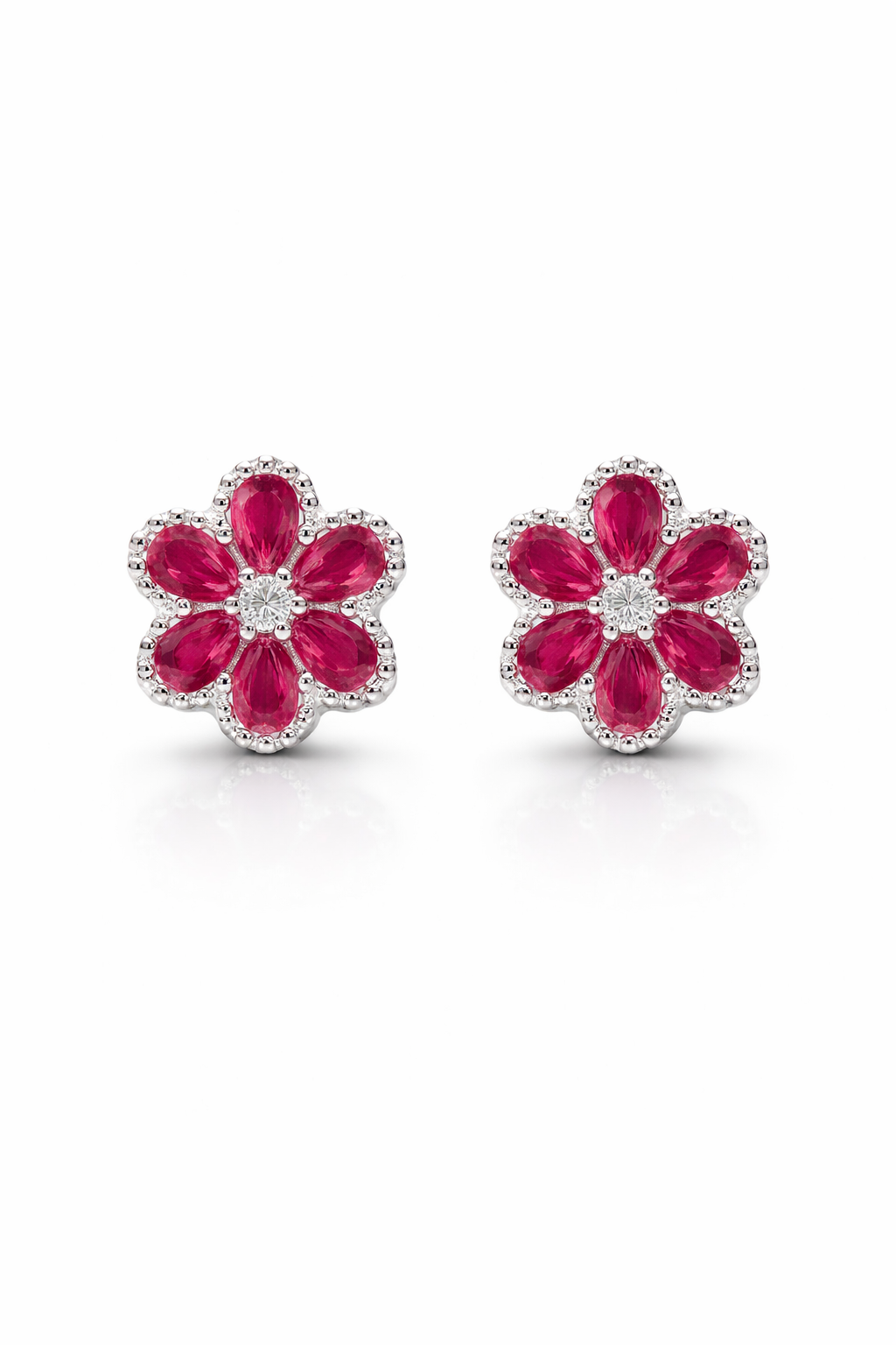 Aros de plata en forma de flor dolor fucsia